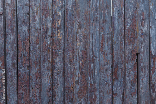 Brown wooden boards or fence texture background or backdrop with old paint © elenaseiryk