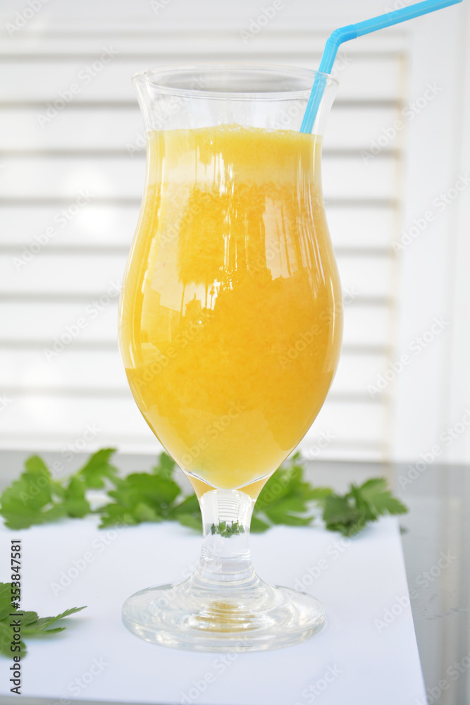 Green parsley and orange in slices on a white Green parsley and orange in slices on a white