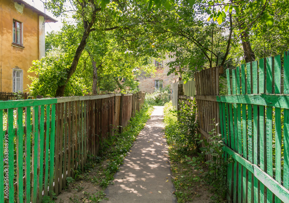 Passage between two fences in the old quarter in Nizhny Novgorod Passage between two fences in the old quarter in Nizhny Novgorod