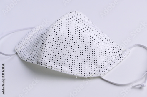 design of white face mask handmade sewing from fashion fabric cotton cloth