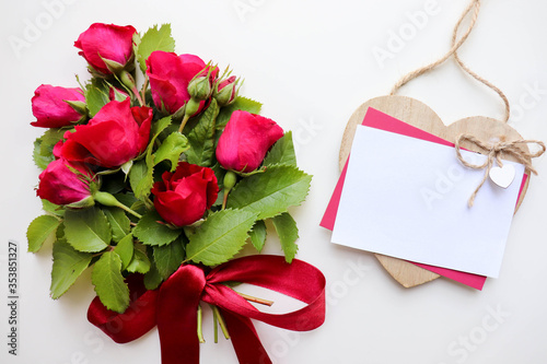 postcard mockup. a small bouquet of red roses and space for text. congratulation. invitation