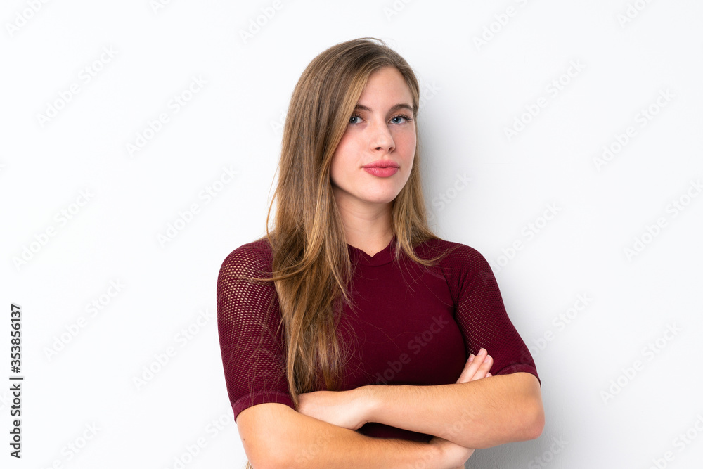 Sport teenager girl over isolated white background keeping the arms crossed Sport teenager girl over isolated white background keeping the arms crossed