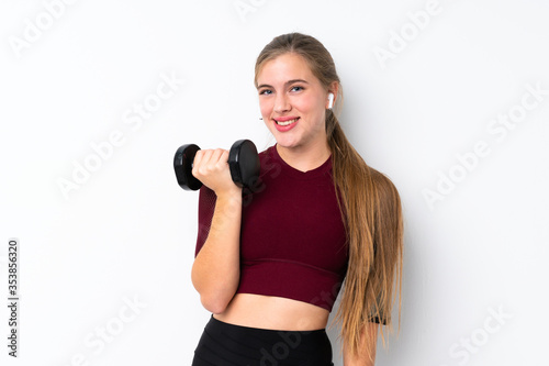 Sport teenager girl over isolated white background making weightlifting