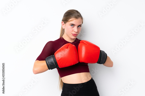 Sport teenager girl over isolated white background with boxing gloves