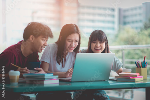 Teenage students are using computers for education via the Internet, Communication system education happy.