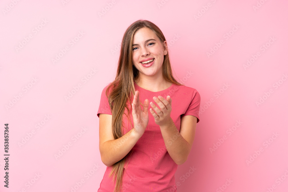 Teenager blonde girl over isolated pink background applauding Teenager blonde girl over isolated pink background applauding