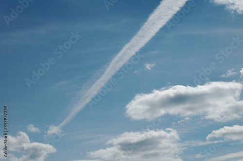 the plane's track in the blue sky