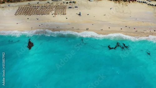 Aerial drone video of iconic turquoise and sapphire bay and beach of Myrtos, Kefalonia (Cephalonia) island, Ionian, Greece. Myrtos beach, Kefalonia island, Greece. Beautiful view of Myrtos beach. photo