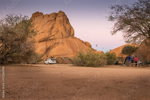 Camping in desert with huge rocks