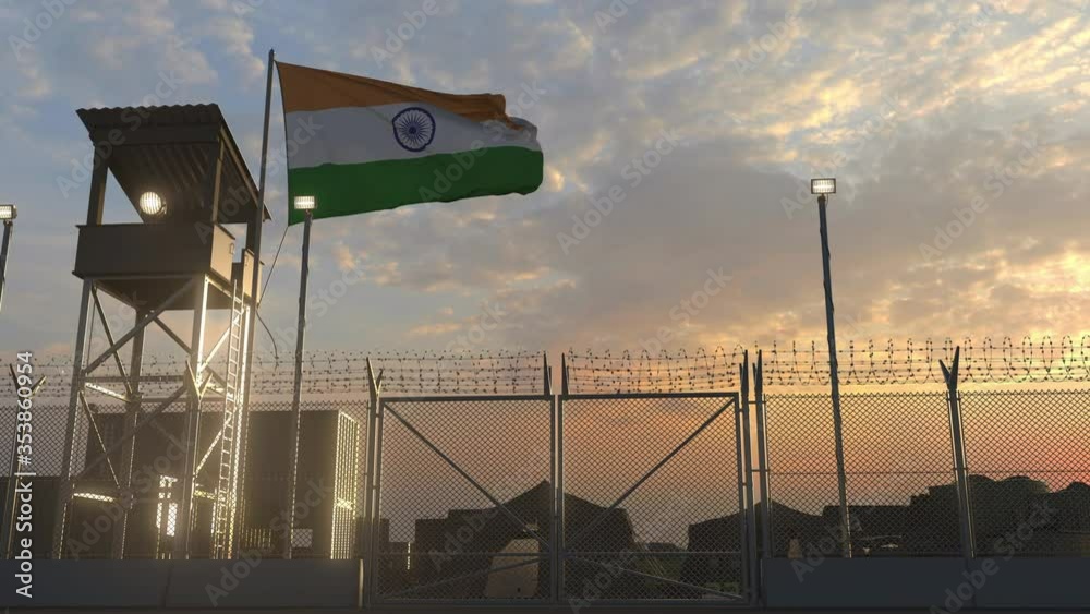 Waving flag of India above military base in the evening