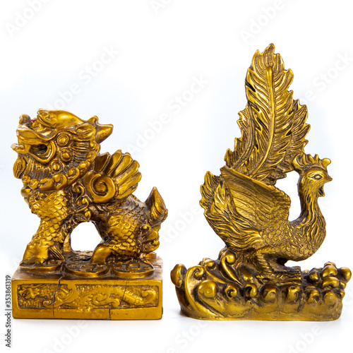 Golden statues ornaments on a white background