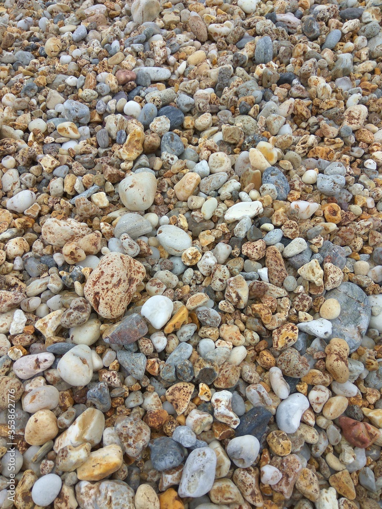 Multi-colored sea pebbles close-up. Greece. Milos island. Summer. Multi-colored sea pebbles close-up. Greece. Milos island. Summer.