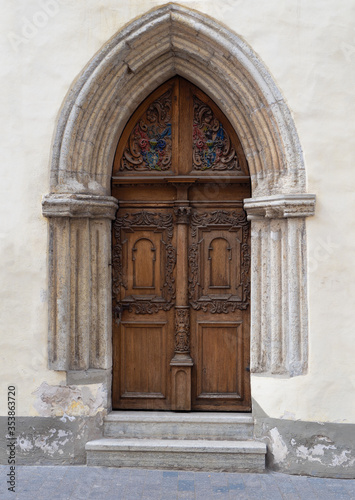 Ornate wooden door and stone archway  © Dawn