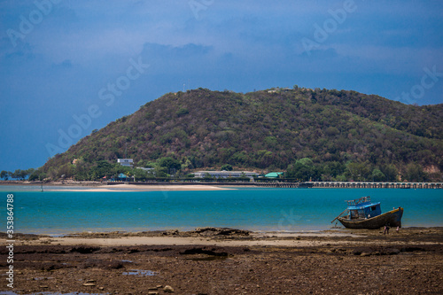 Blurred background of natural atmosphere by the sea, with clear skies and fishing boats mooring
