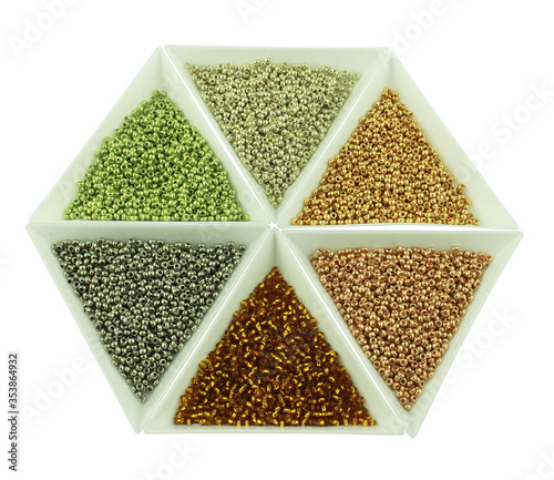 6 colors of beads in counter isolated on white background