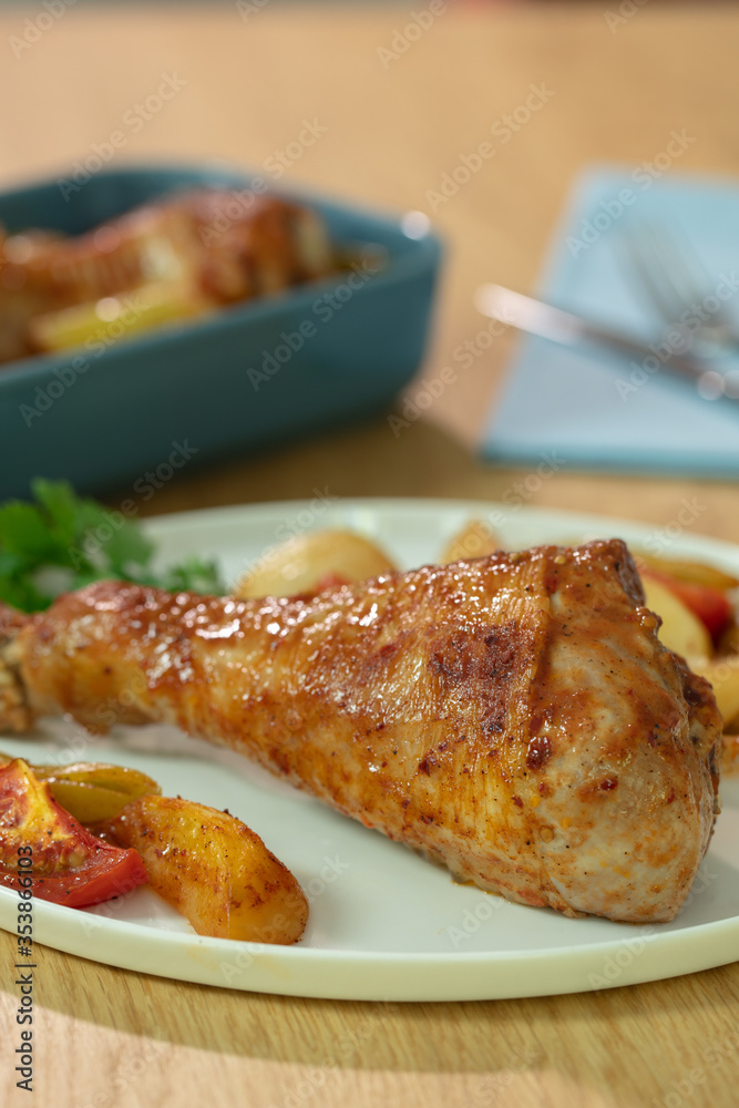 Roasted chicken legs with potato and tomatoes Roasted chicken legs with potato and tomatoes