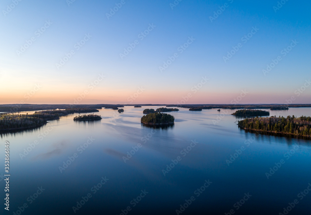 An aerial view of the islands of Eagle Lake Ontario, Canada at sunset.