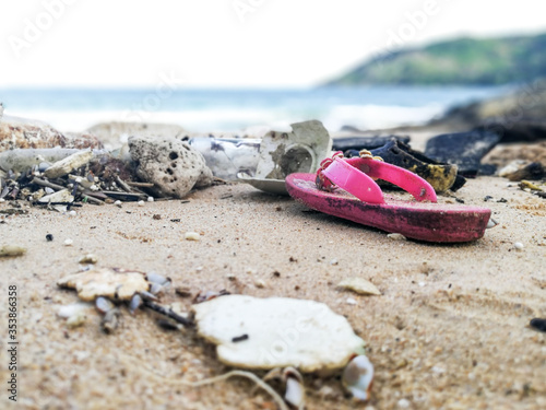 Pollutants and plastic garbages on the beach
