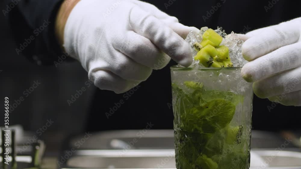 Glass of Classic Mojito Cocktail slowly moving and rotating. Close up