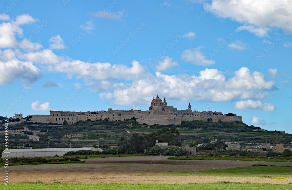The fortified city of Mdina in Malta stands tall on the horizon
