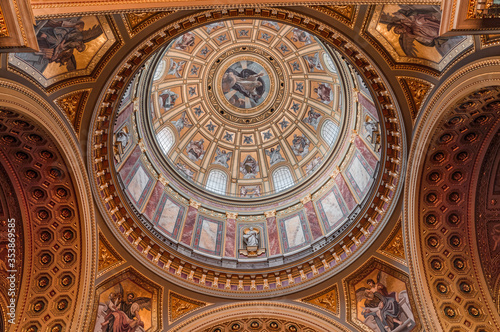 Budapest  Hungary - Feb 8  2020  Upward view of gilded golden dome cupola inside St. Stephen s Basilica