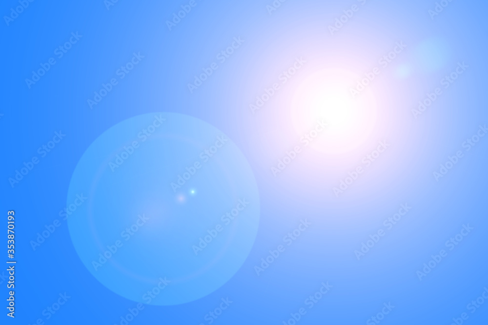 Lens flares from the sun on blue clear sky, nature background