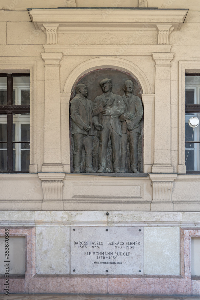 Budapest, Hungary - Feb 8, 2020: Bronze relief of 3 agronomists at acaare memorial kossuth square