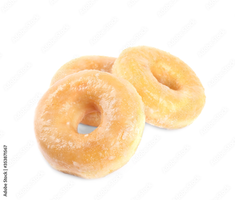 Sweet delicious glazed donuts on white background