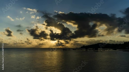 sunrise time lapse over the sea in natuna island, Indonesia during low tide.