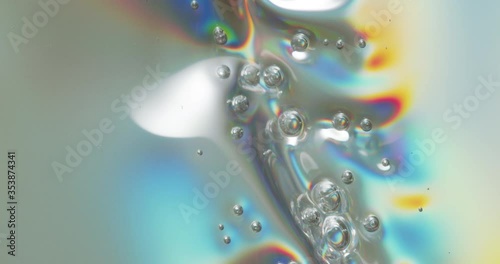 Bubbles On Melting Plastic. Bubbles forming across a melting plastic surface.