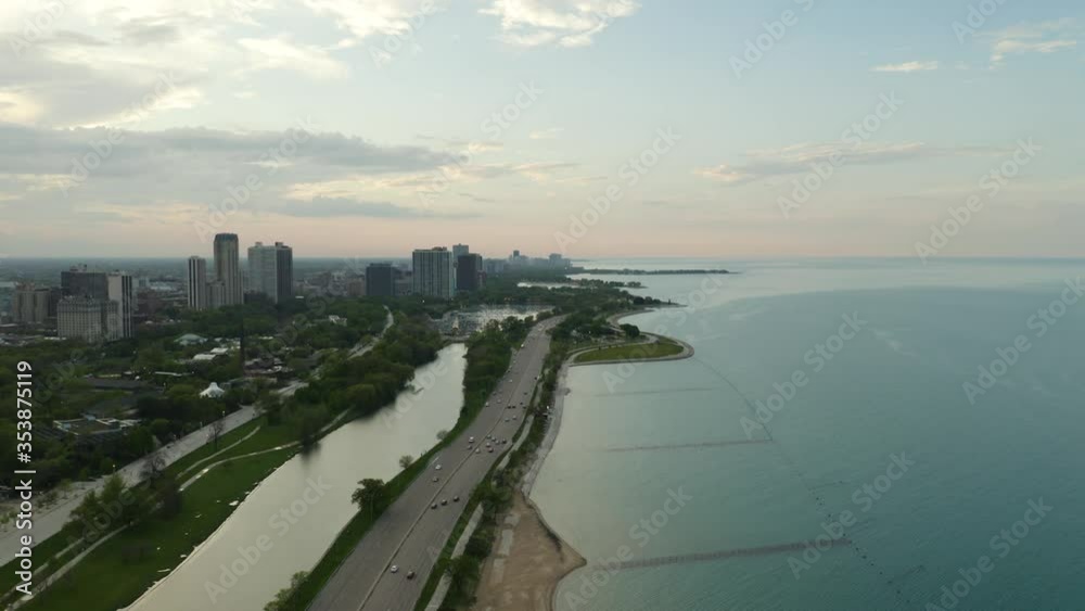 Birds Eye View of Cars Driving on Lakeshore Drive during Summer Sunset in Chicago
Birds Eye View of Cars Driving on Lakeshore Drive during Summer Sunset in Chicago