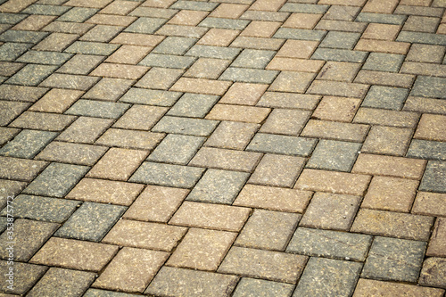 Cubical stone background. Cubical stone pavement on the street.