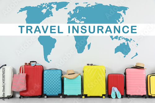 Принти на полотні Colorful suitcases and phrase TRAVEL INSURANCE on light background