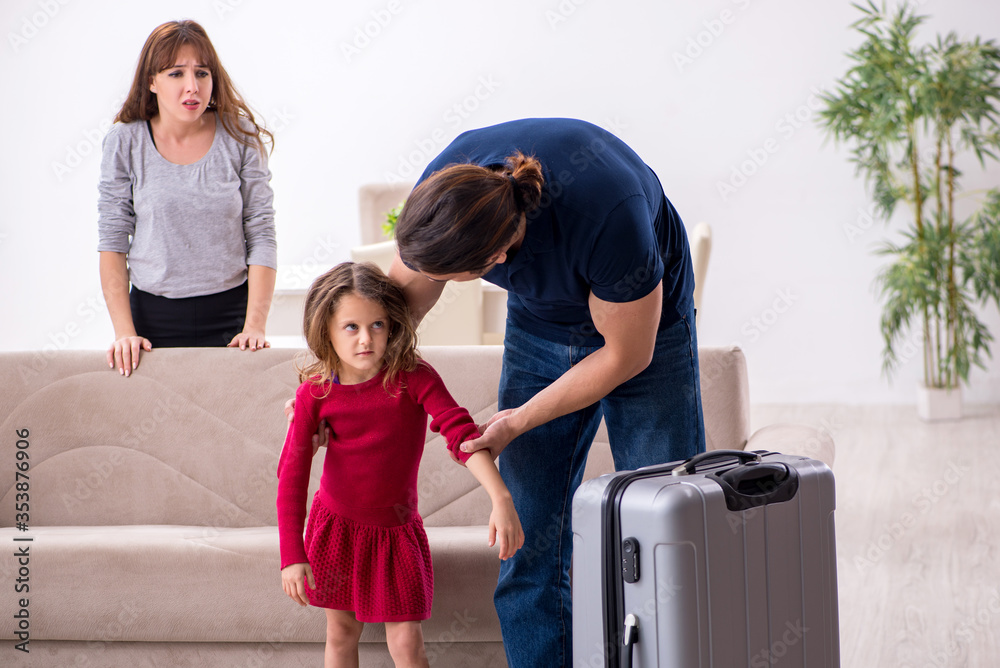 Young couple and their daughter in family conflict concept