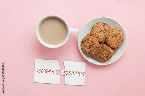 coffee, sweet cookies on a pink background and the inscription sugar addiction 