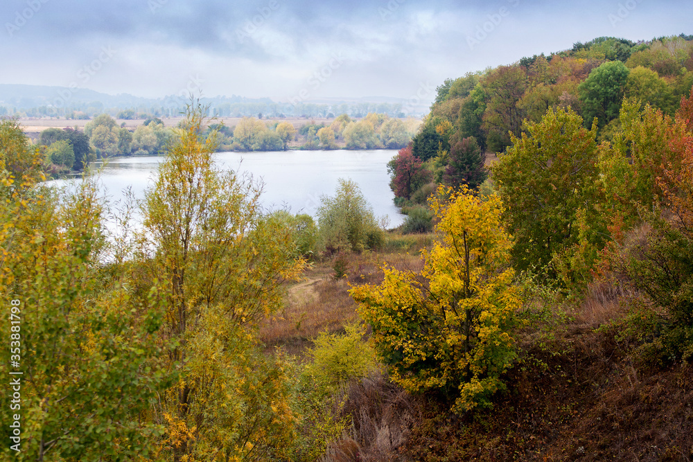 Autumn landscape with forest on the river bank Autumn landscape with forest on the river bank