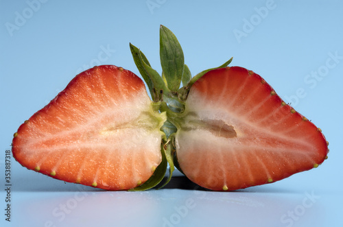 two halves of ripe strawberrу, front view