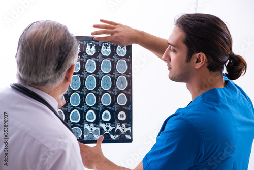 Two male doctors working in the clinic