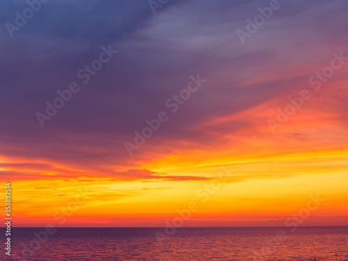 Amazing dramatic sunset sky over calm sea