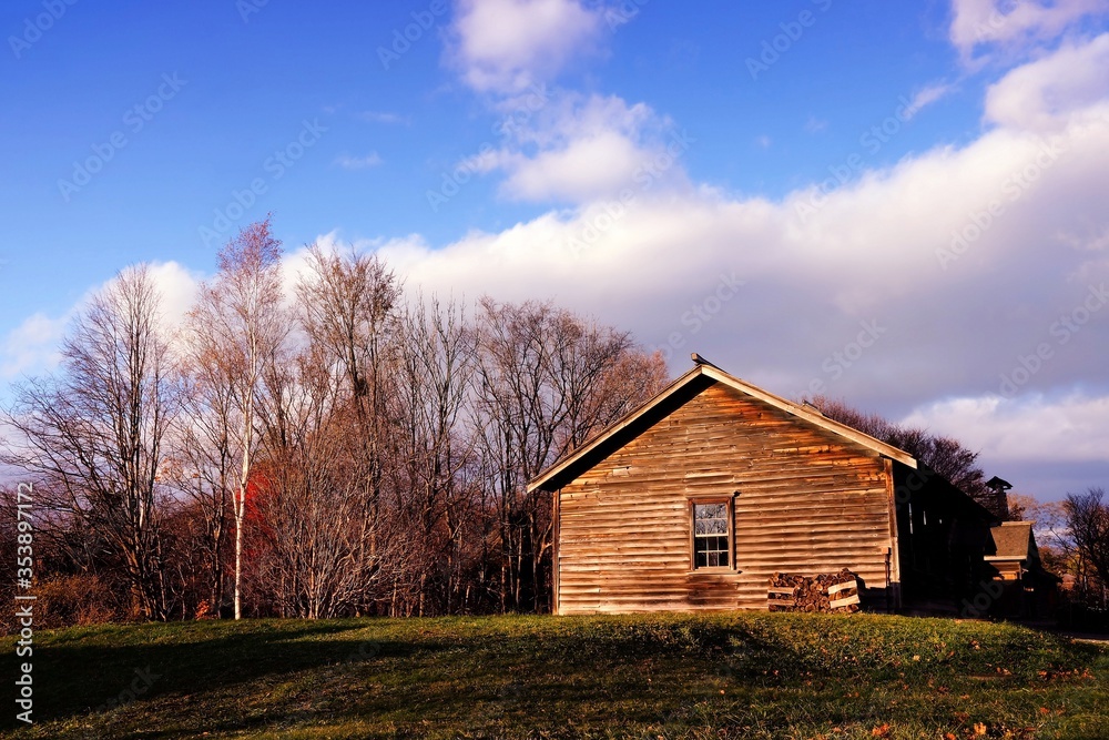 Old Wooden Cottage in the Autumn with Beautiful Blue Sky.