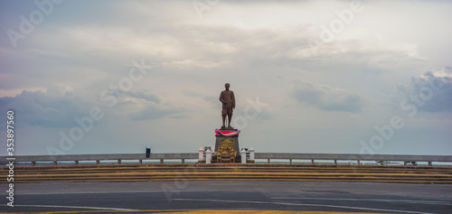 Phatthalung, THAILAND - July 8, 2019: King statue in the beautiful sky at Lampam beach photo