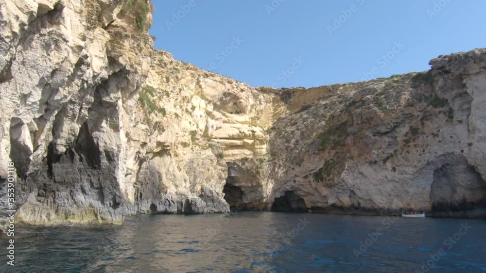 Boat ride POV of Beautiful Rock formations bay with sea caves on the Mediterranean natural coastline in Malta, Europe Boat ride POV of Beautiful Rock formations bay with sea caves on the Mediterranean natural coastline in Malta, Europe