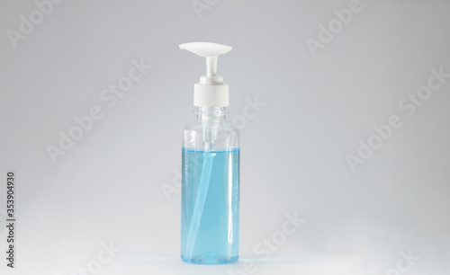 Hand sanitizer bottle, white pump head, clear bottle on a white background