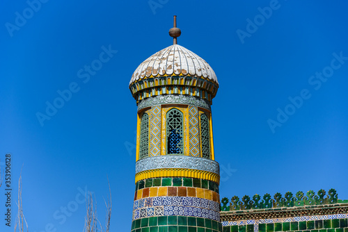 Minaret of the 17th century Tomb of Abakh Khoja or Xiangfei in Kashgar, Xinjiang, China photo
