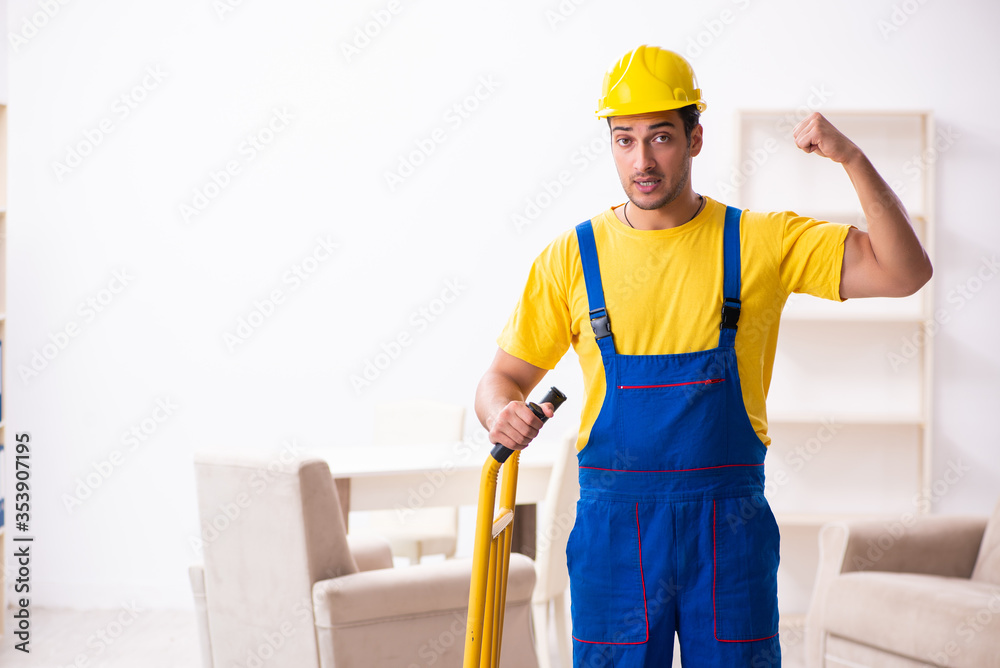 Young male contractor in relocation concept
