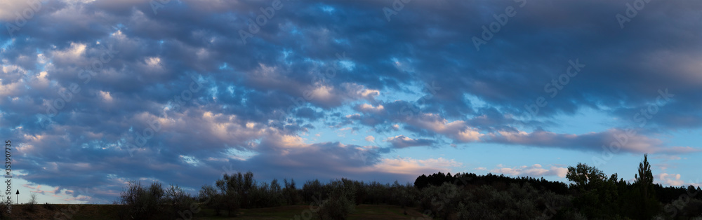 Purple-magenta clouds. Cirrus cloudscape on blue sky.Tragic gloomy sky. Landscape with bloody sunset. Fantastic skies on the planet earth. Purple-magenta clouds. Cirrus cloudscape on blue sky.Tragic gloomy sky. Landscape with bloody sunset. Fantastic skies on the planet earth.