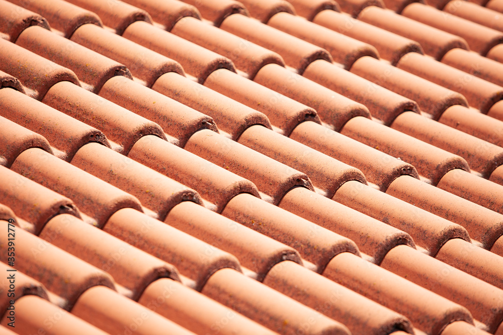 Closeup of orange red clay roof tile seamless pattern for house covering in red color Closeup of orange red clay roof tile seamless pattern for house covering in red color