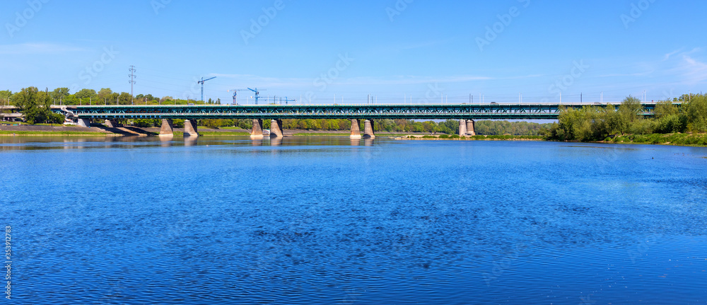Panoramic view of Gdansk Bridge - Most Gdanski - two-deck steel truss construction over Vistula river in northern part of Warsaw, Poland