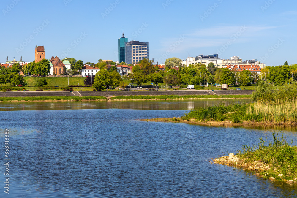 Panoramic view of New Town quarter - Nowe Miasto - and Muranow district with Wybrzerze Gdanskie and wild banks of Vistula river in Warsaw, Poland