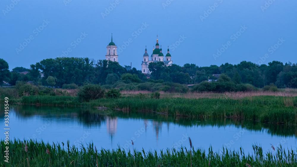 Monastery over the evening lake